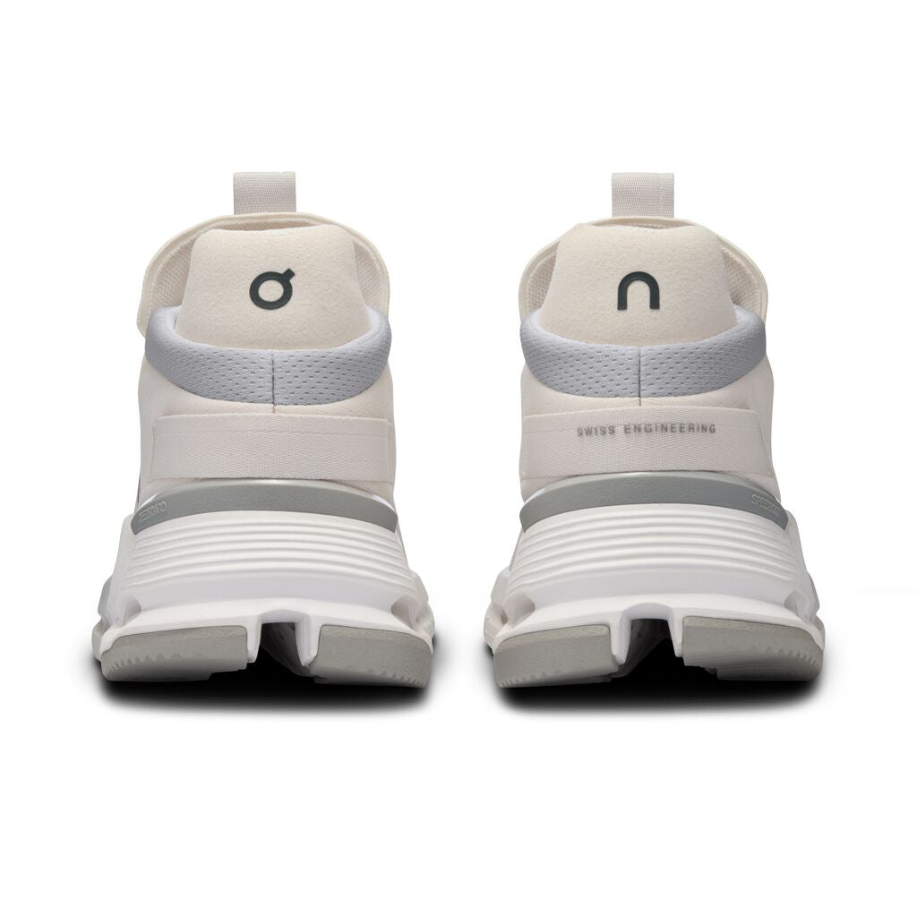 The Cloudnova has half the On logo on the left heel and the other half on the right heel