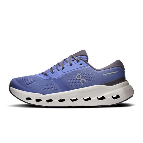 Blue running shoe with white sole on a white background