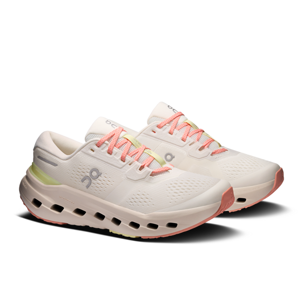 White running shoes with pink laces on a white background