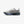 Grey, green, and blue running shoe on a white background