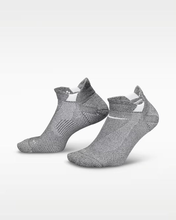 A pair of running socks from Nike that are grey and white.