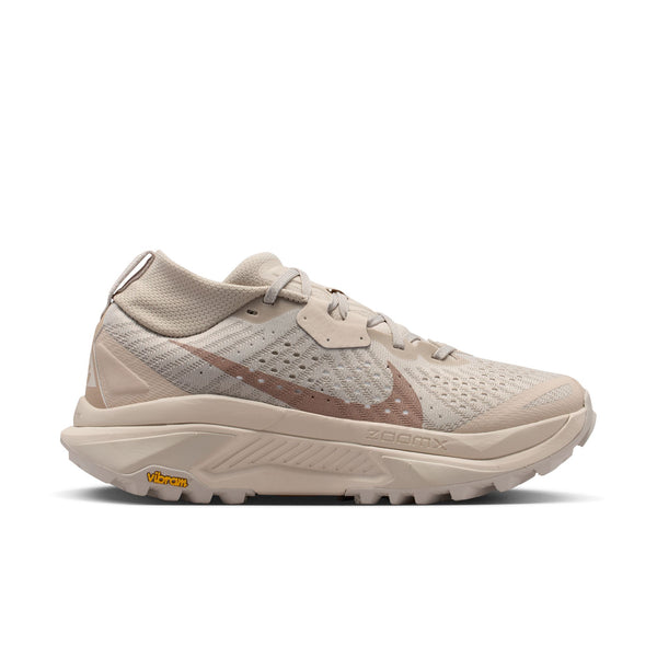 Beige running shoe on a white background