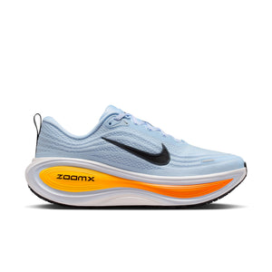 Light blue running shoe with orange sole and black Nike logo on a white background