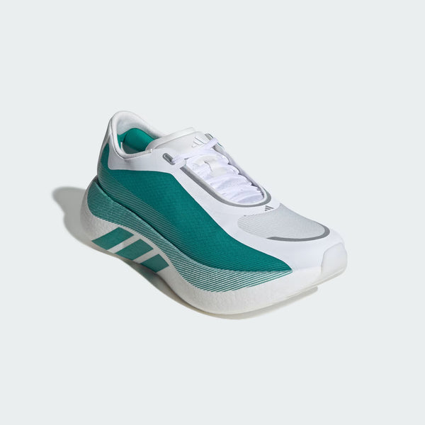 A green and white shoe with white laces and a small adidas logo over the toes.