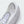 Close-up of a white and light gray athletic shoe showing the toe box, laces, and textured mesh and synthetic overlays.