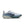 White running shoe with blue accents and black Nike logo on a white background