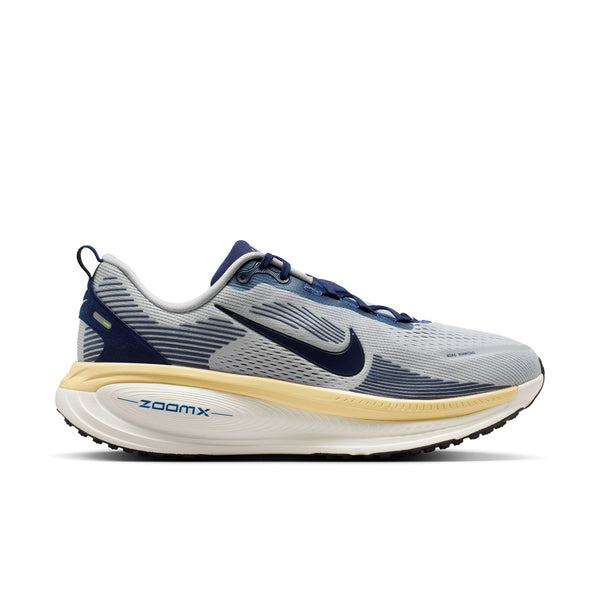 Gray and blue running shoe with 'ZoomX' on a white background