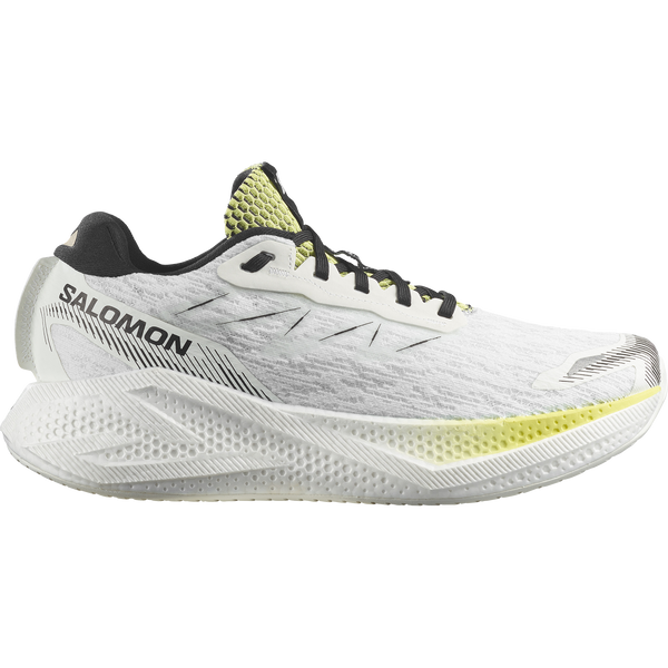 White, lime green, and black running shoe on a white background