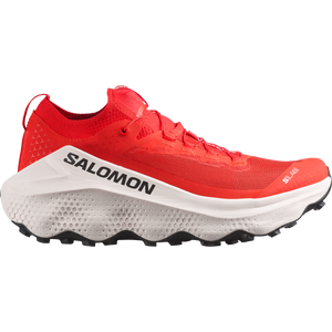 White, red, and black trail running shoe on a white background