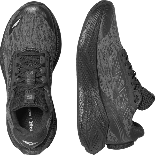 All black running shoe on a white background