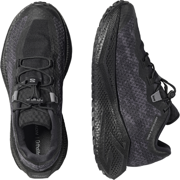 All black gravel running shoe on a white background