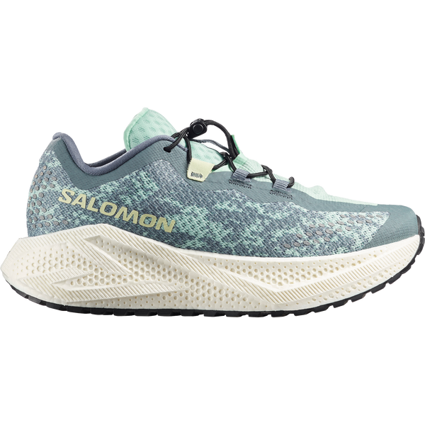 Teal and off-white gravel running shoe on a white background