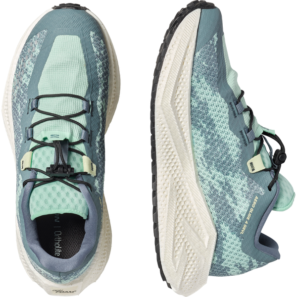 Teal and off-white gravel running shoe on a white background