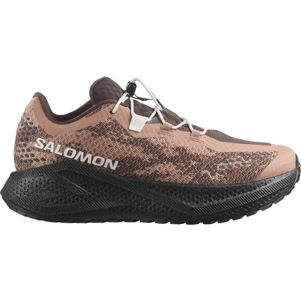 Brown and black gravel running shoe on a white background
