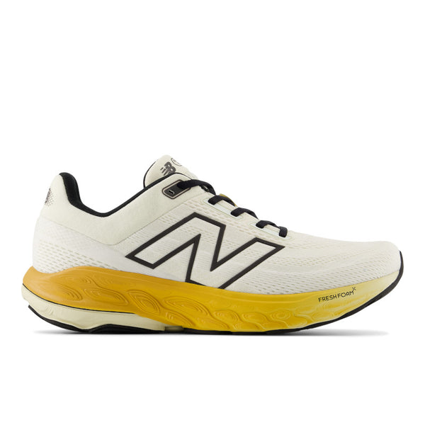 This image features the Men's 860 V14 running shoe by New Balance, showcased in a clean white color with contrasting yellow accents. The shoe is designed for comfort and stability, evident from its sturdy sole and well-cushioned midsole.