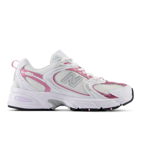 White and pink running shoe with New Balance logo on a white background.