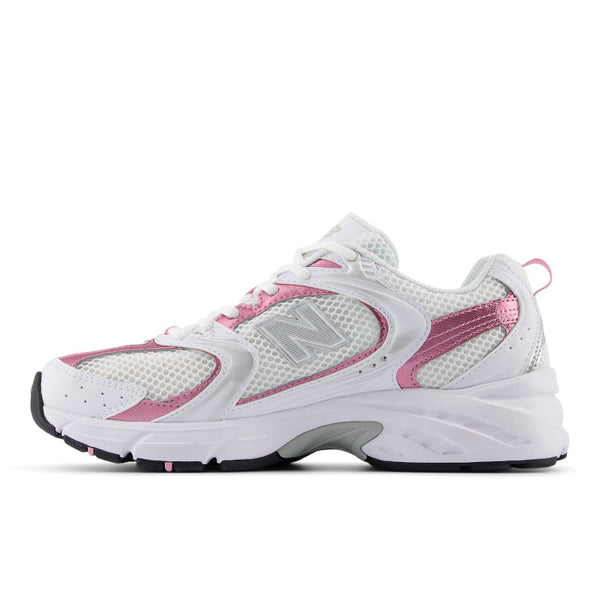 White and pink running shoe with New Balance logo on a white background.