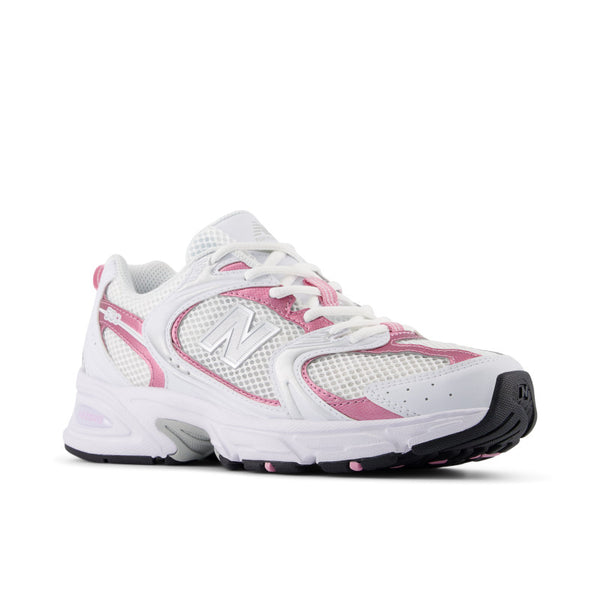 White and pink running shoe with New Balance logo on a white background.