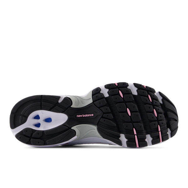 White and pink running shoe with New Balance logo on a white background.