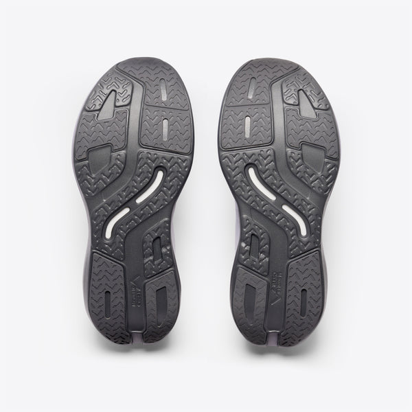 A light gray and purple running shoe with a dark gray sole and logo, featuring the text 'Mount to Coast' on the side