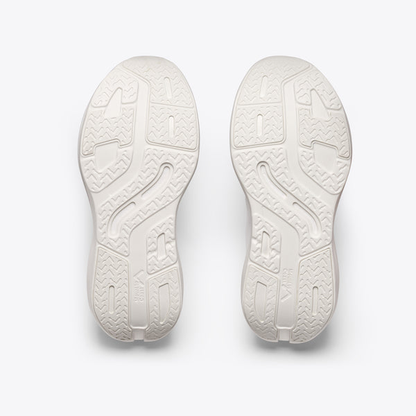 White running shoe with red and black accents on a white background