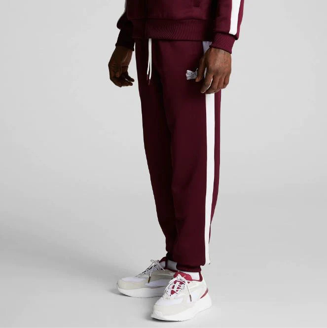  PUMA’s iconic T7 track pants are reimagined with contrast drawstrings, tapered side stripes, and authentic PUMA x TMC cobranding.