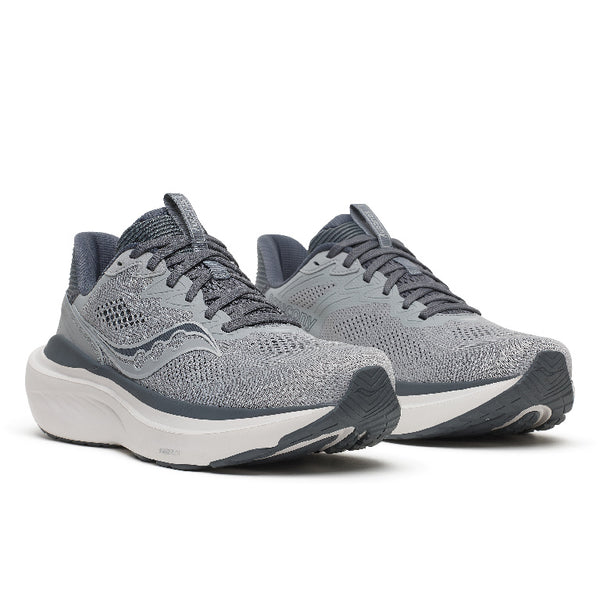 A pair of gray and white running shoes with a textured knit upper, dark gray laces, and a thick white midsole, shown against a plain white background.