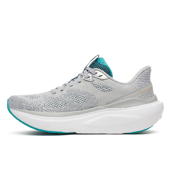 A light gray Saucony running shoe with a thick white midsole and teal accents on the logo, collar lining, and outsole, shown on a white background.
