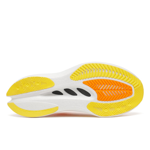 Close-up of a shoe sole with yellow and orange tread pattern on a white background