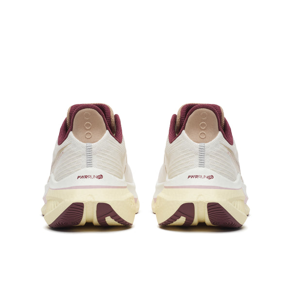 White running shoes with maroon soles on a white background