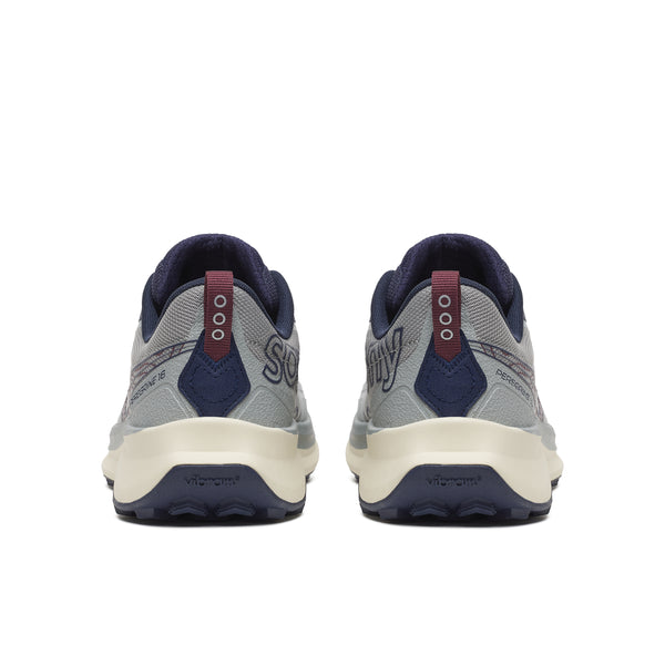 Back view of gray and navy running shoes on a white background