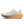White running shoe with orange sole on a white background