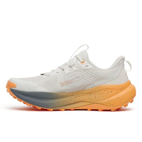 White running shoe with orange sole on a white background