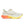 White running shoe with orange sole on a white background