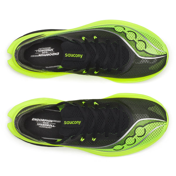 Black and green running shoes with 'Saucony' branding on a white background