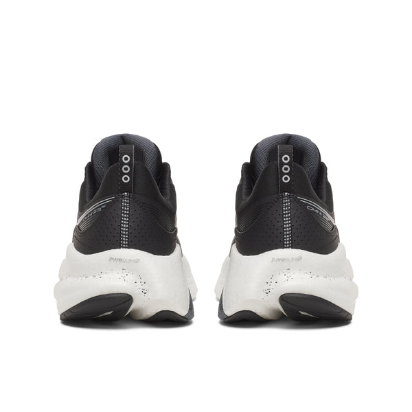 Black running shoes with white soles on a white background