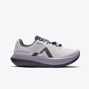 A light gray and purple running shoe with a dark gray sole and logo, featuring the text 'Mount to Coast' on the side