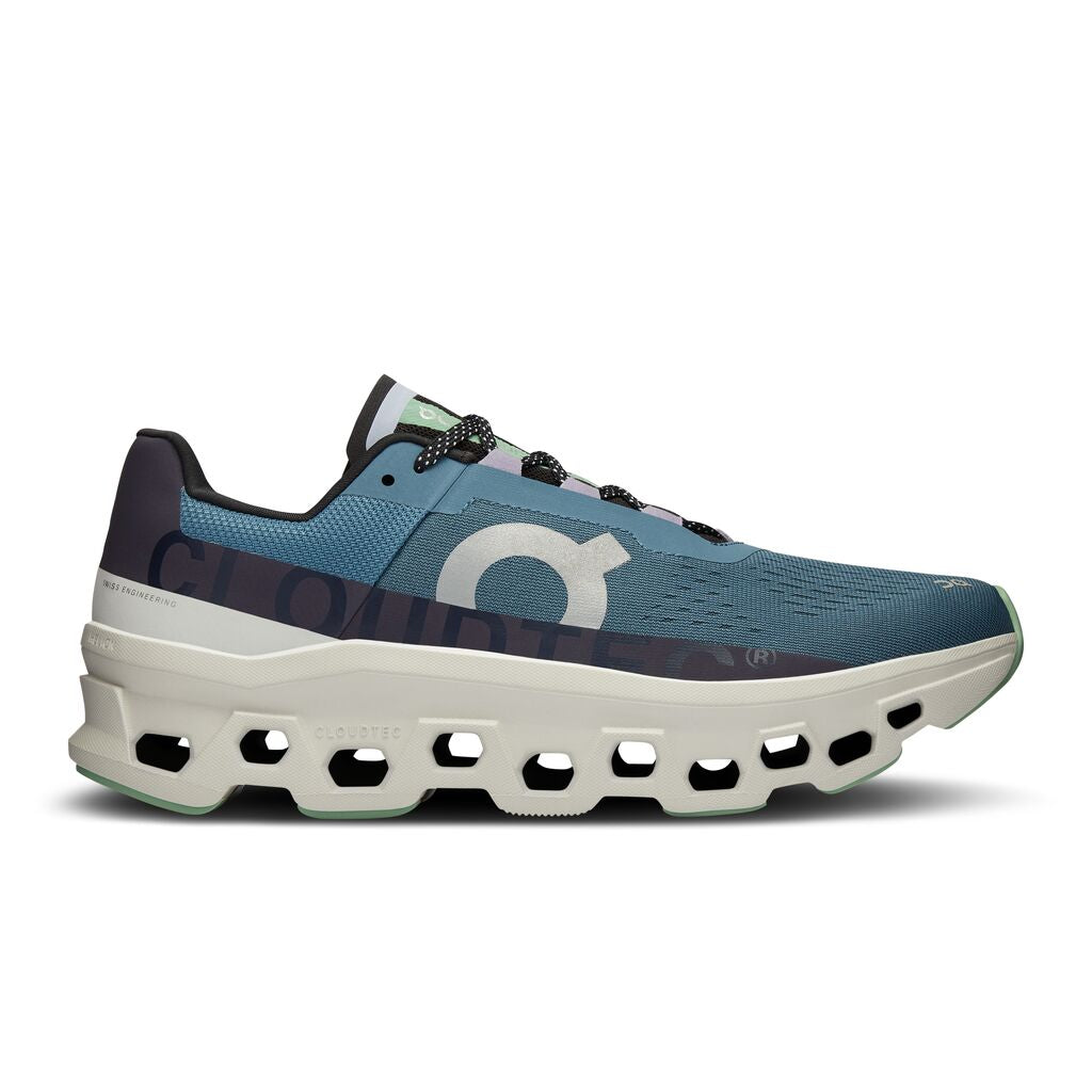  monster of a sensation meets big performance in the Men's Cloudmonster from On. It features a light, durable and temperature resistant midsole that comes in a bold rocker shape