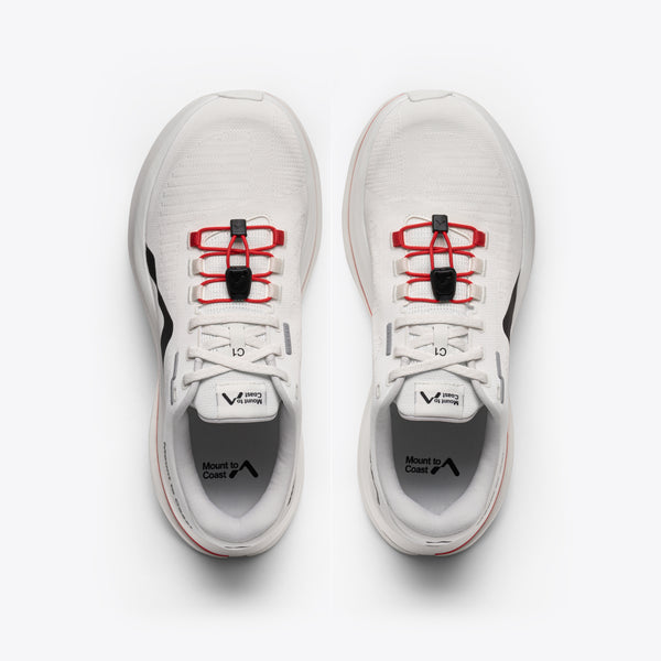 White running shoe with red and black accents on a white background