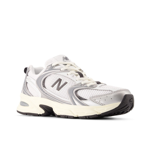 White and gray sneaker with New Balance logo on a white background
