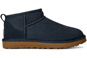 Navy ugg slipper with a tan midsole