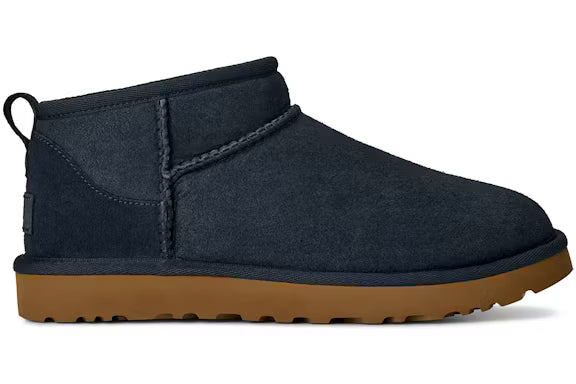 Navy ugg slipper with a tan midsole
