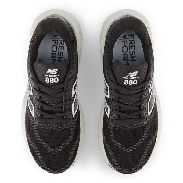 Black New Balance 880 sneakers on a white background