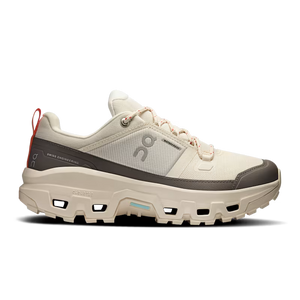White athletic shoe with gray sole on a white background