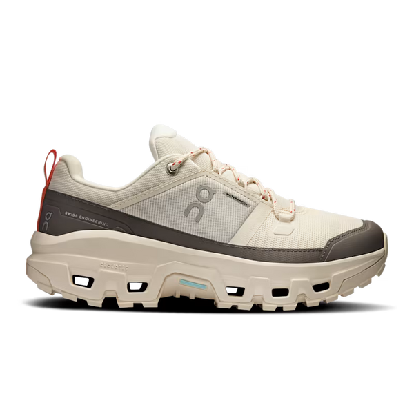 White athletic shoe with gray sole on a white background