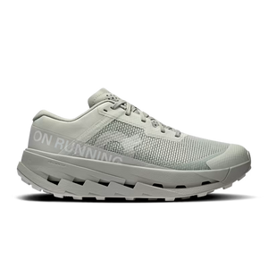 White and grey women's trail shoe with unique design on a black background