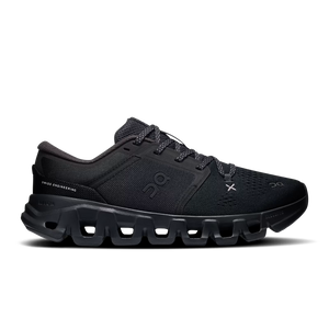 A black On gymshoe with a chunky, hollowed-out sole, shown in a side profile view against a white background.