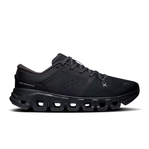A black On gymshoe with a chunky, hollowed-out sole, shown in a side profile view against a white background.