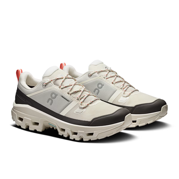 Grey and cream hiking shoe on a white background