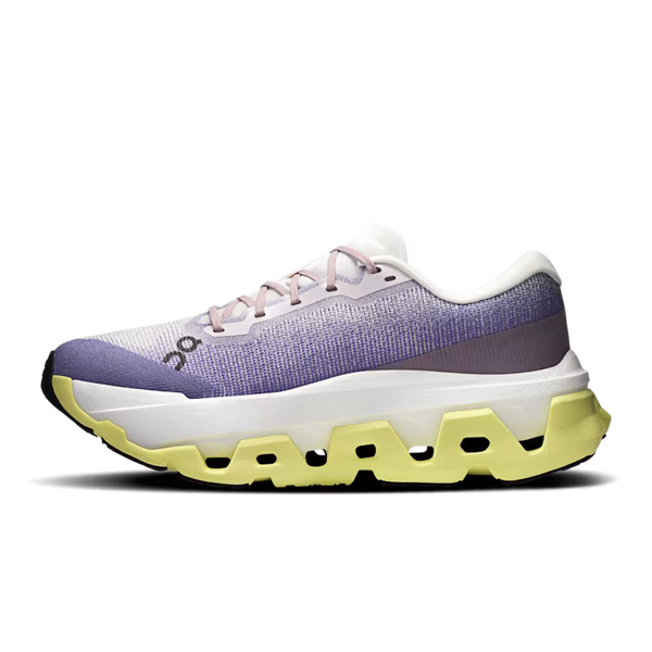 White and purple running shoe with yellow sole on a white background